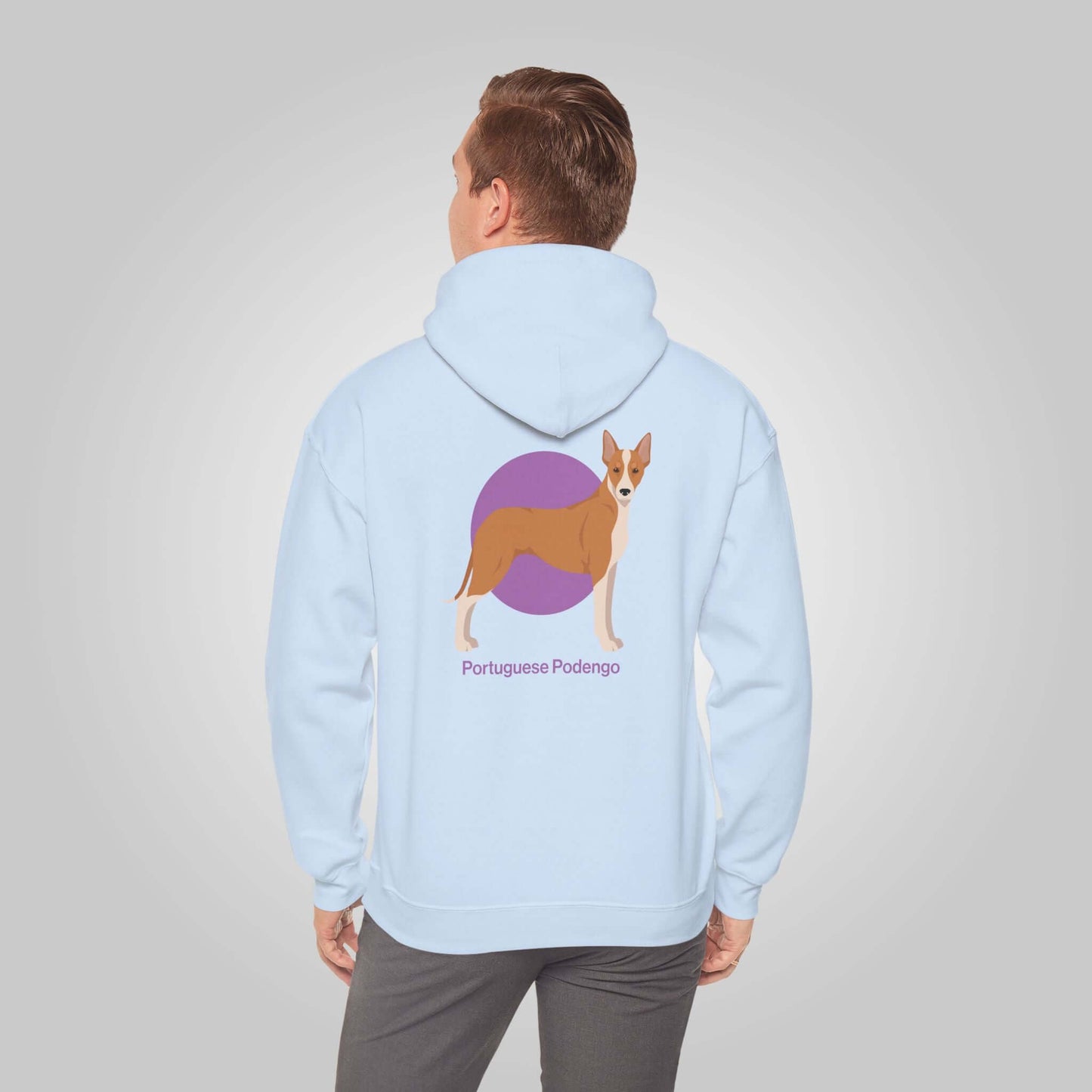 Man wearing a blue Portuguese Podengo hoodie, design features a colorful graphic of the energetic hunting dog.