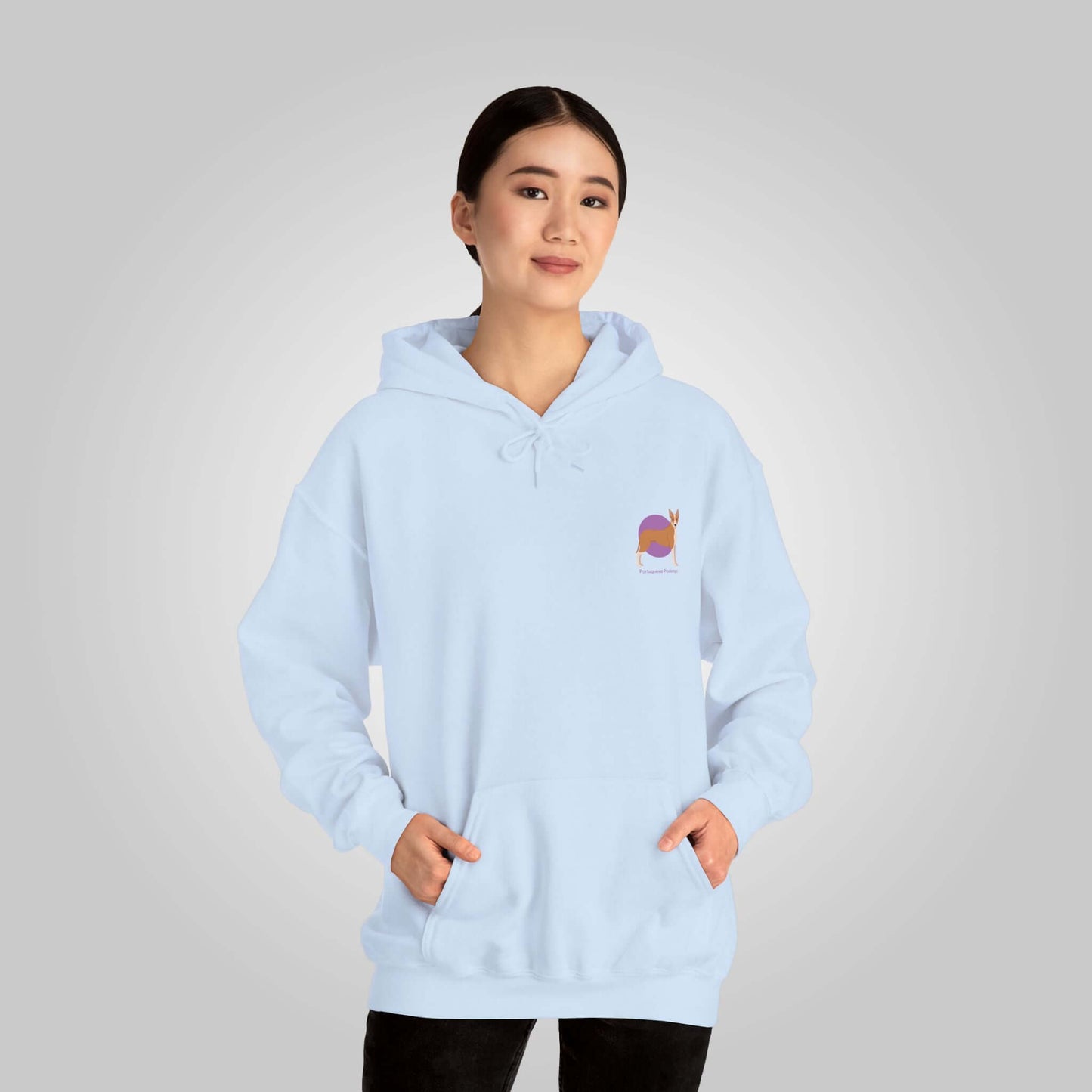 Woman modeling light blue Portuguese Podengo hoodie with dog graphic on chest, casual style