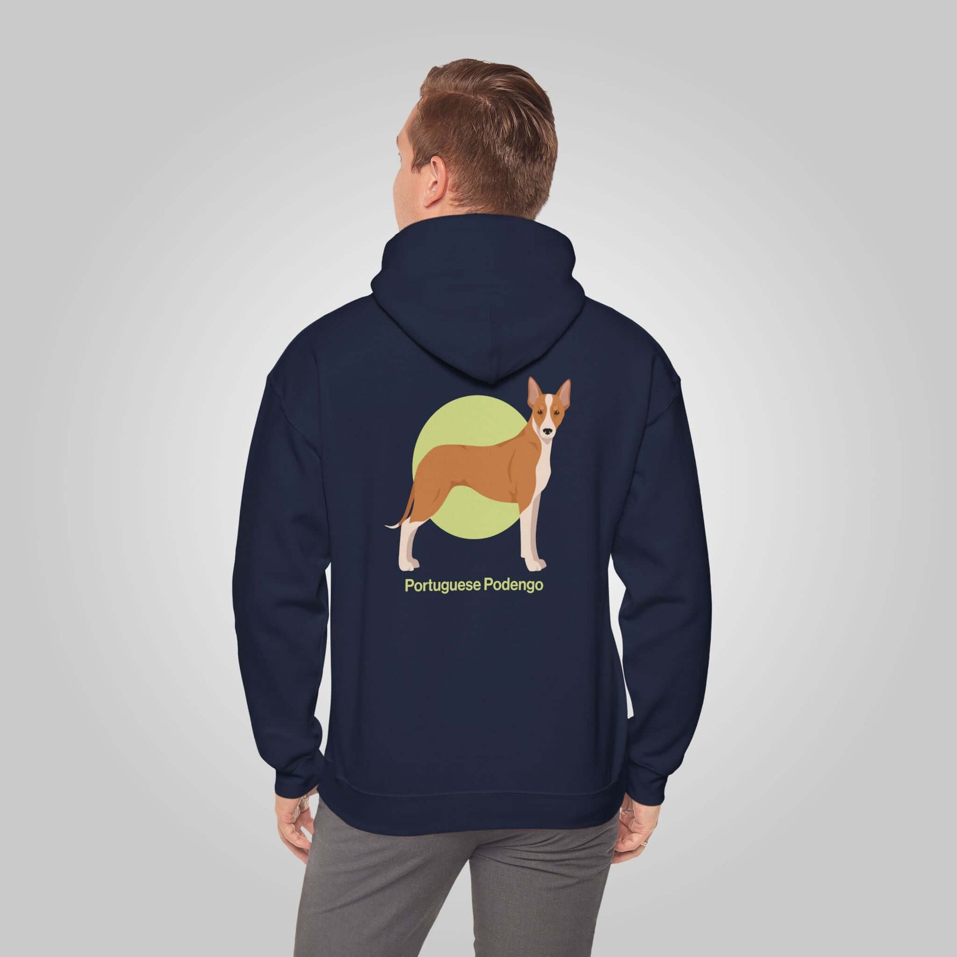 Man wearing navy blue Portuguese Podengo hoodie with graphic of dog on the back, perfect for dog enthusiasts.