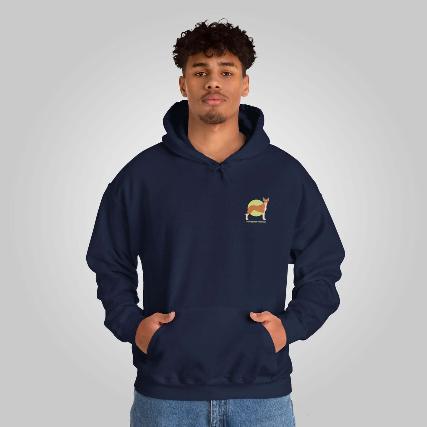 Young man wearing a navy blue Portuguese Podengo hooded sweatshirt with a small dog design on the front