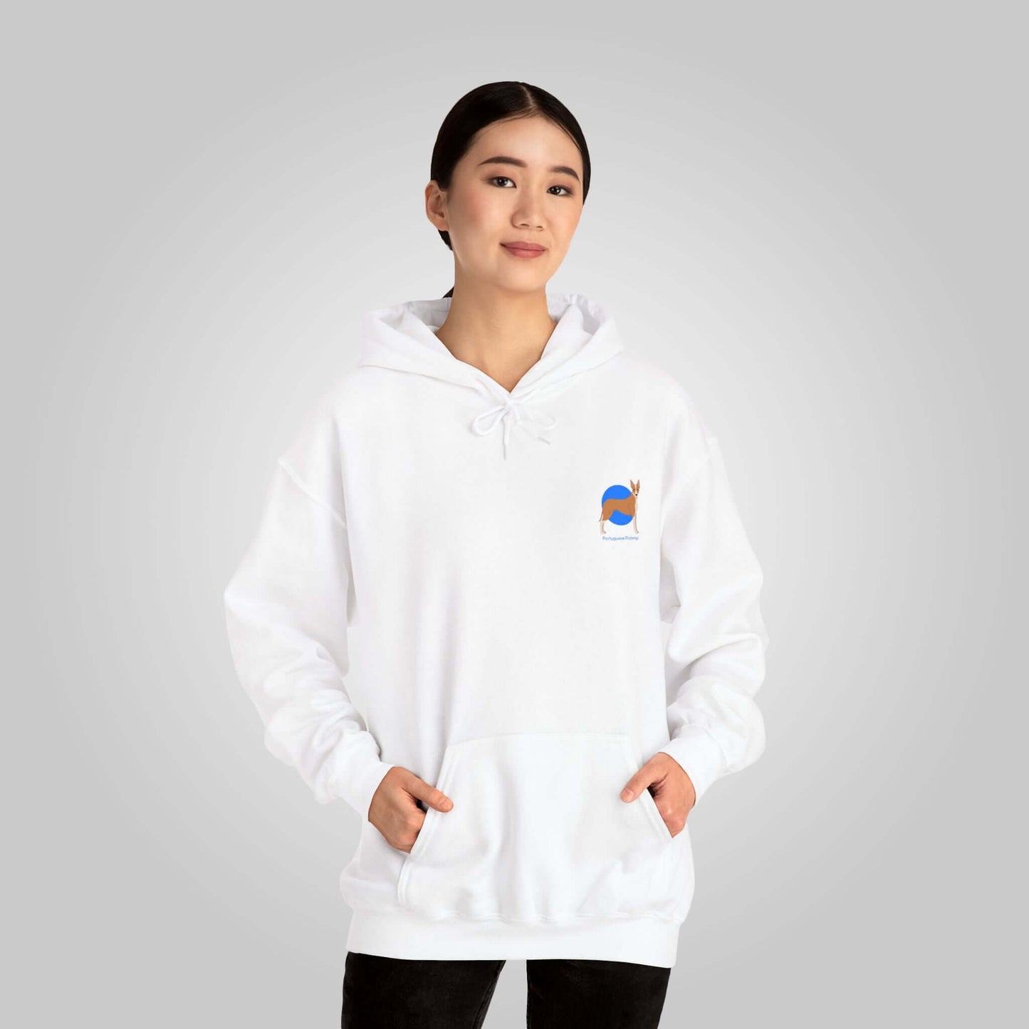 Woman modeling a white Portuguese Podengo unisex hoodie with dog logo on chest, casual style.